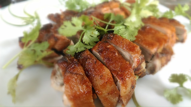 roasted duck slices topped with cilantro