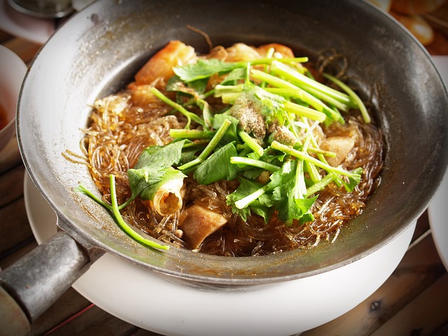 closeup of a bowl of Thai soup with lemongrass